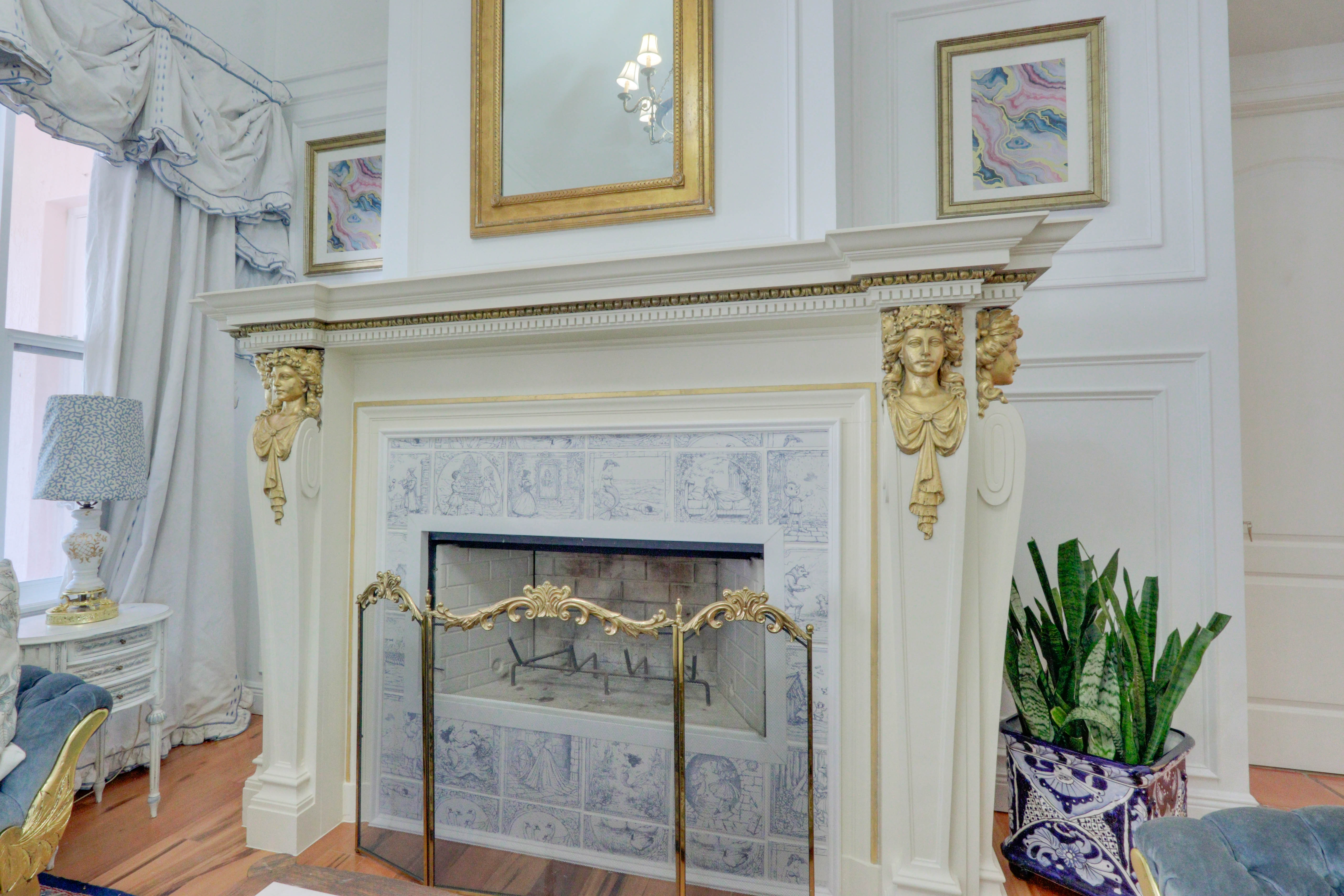 Ornate fireplace detail inside Maison Sarti — European heritage craftsmanship