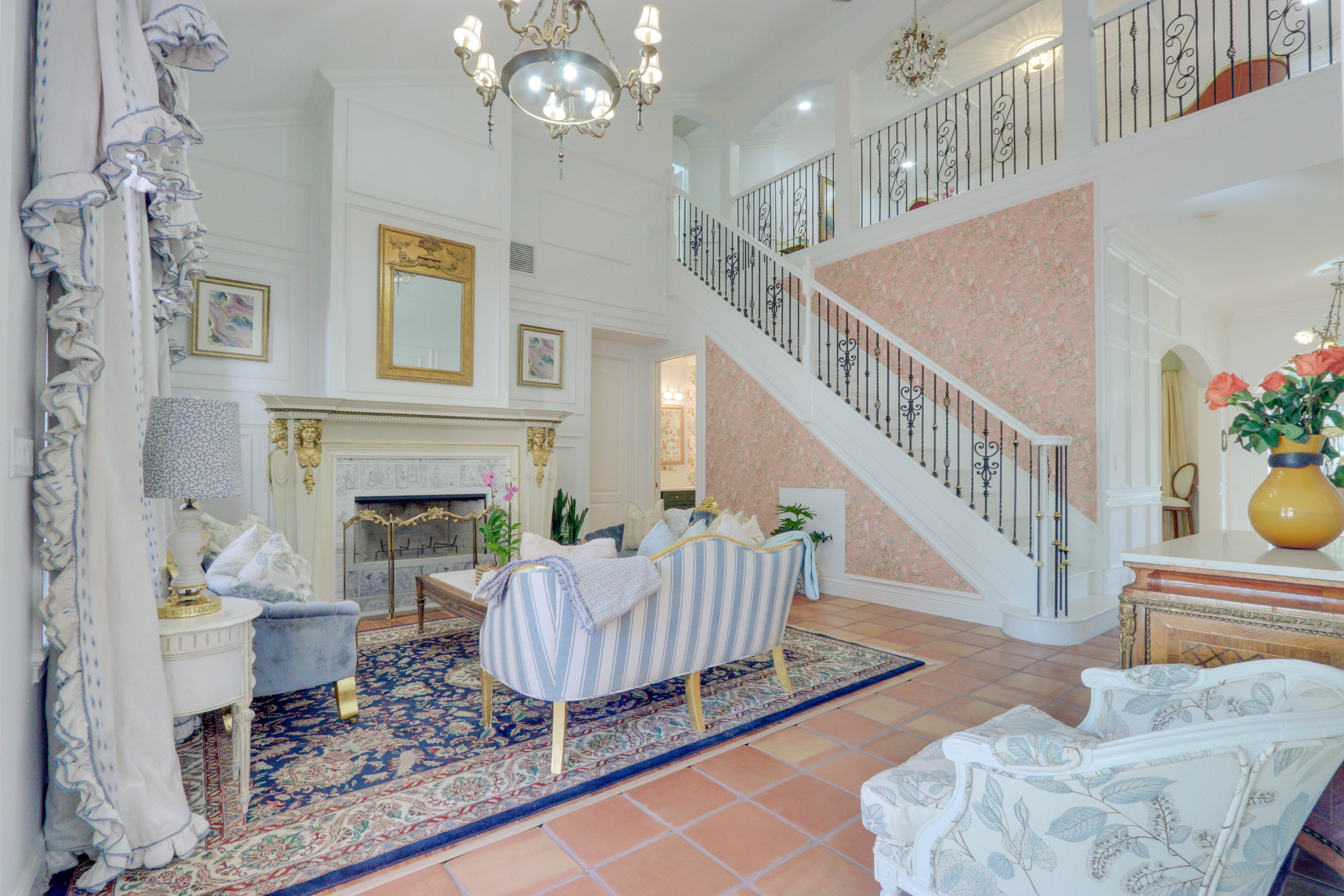 Grand Salon living room at Maison Sarti with staircase and formal seating